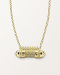 Antique Pave openable amulet necklace in 14K or 18K yellow gold, closed, on a warm bone-white background.
