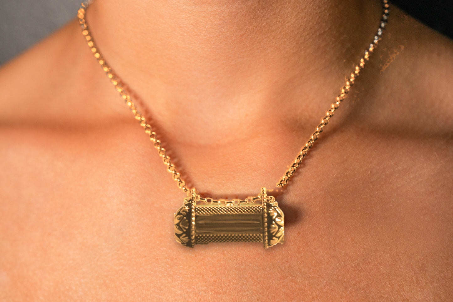 Pushpa Kavacha gold amulet necklace worn on model