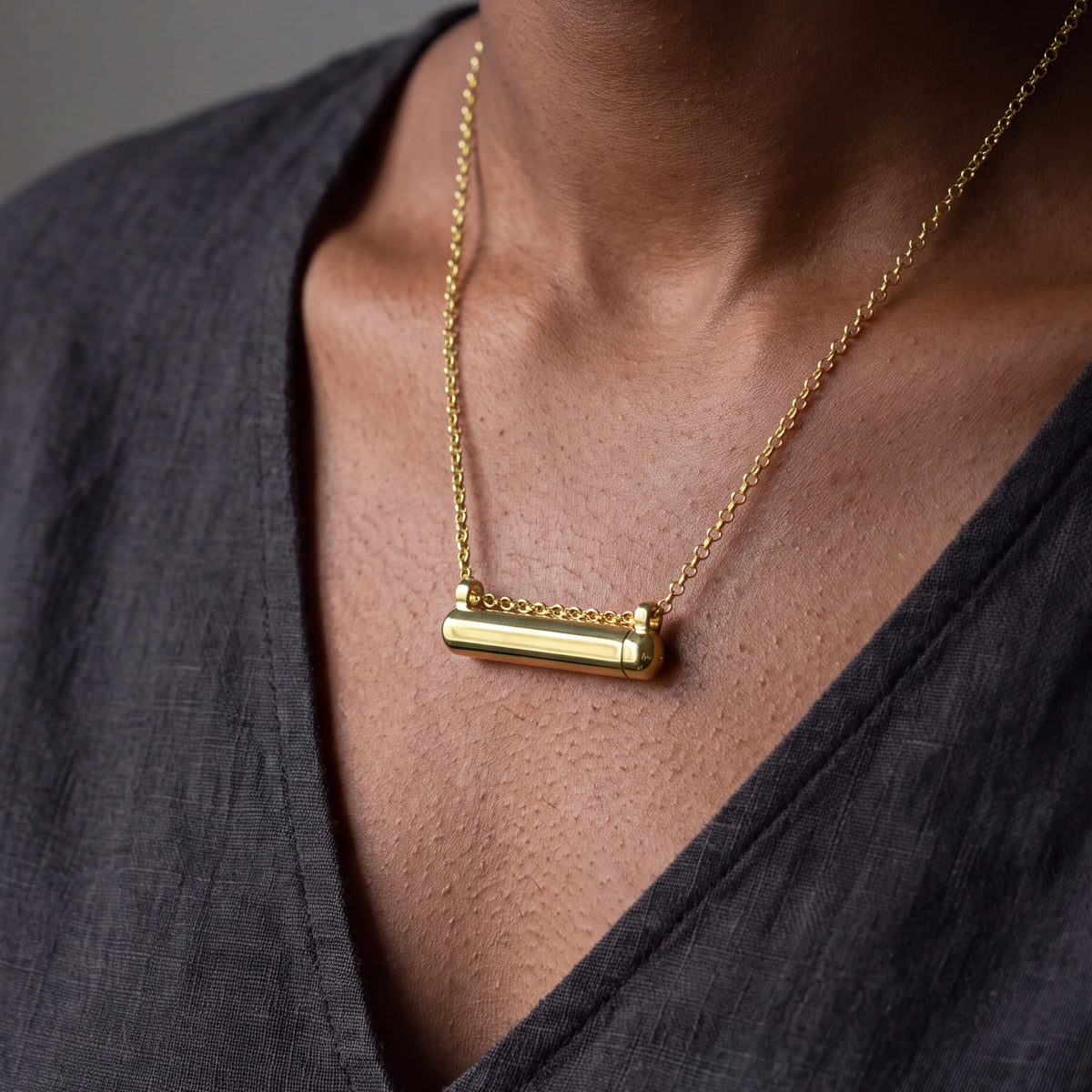 Kerala Small openable amulet necklace in 14K or 18K yellow gold, worn close to the heart. Generated portrait based on product photographs, with measured gold colour correction.