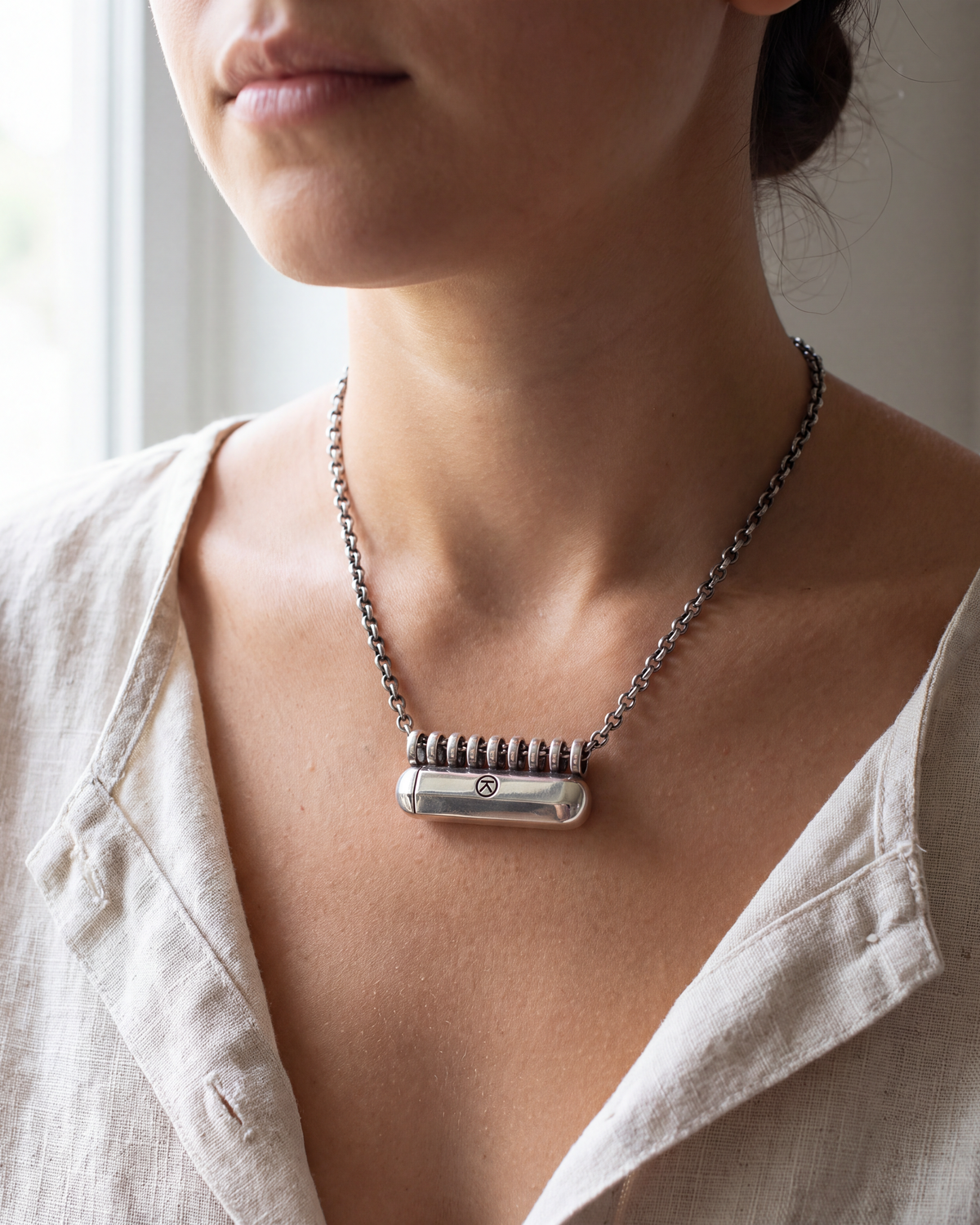 Kerala Large sterling silver amulet necklace worn at the collarbone (illustrative scene)