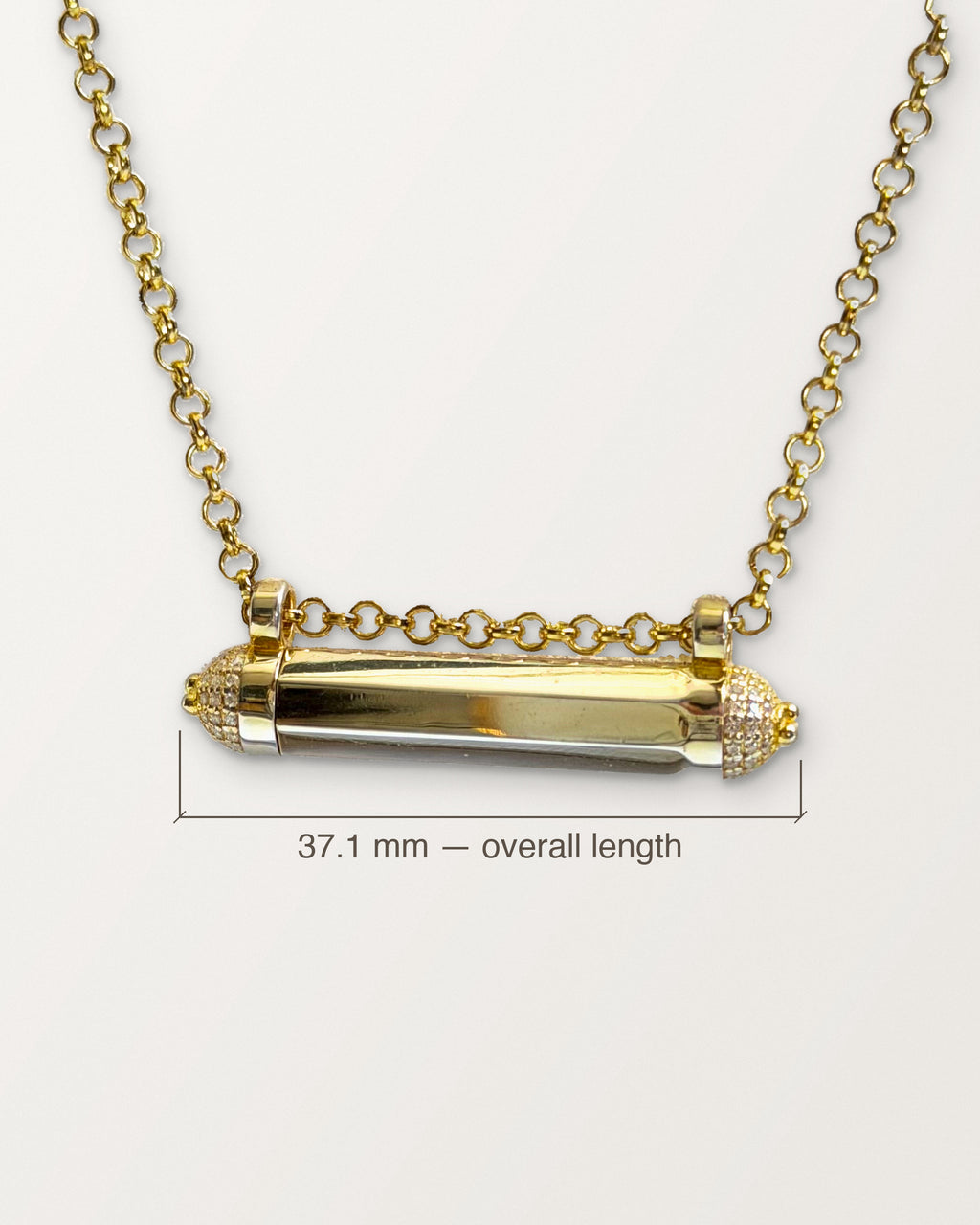 Kerala Pave amulet in 14K or 18K yellow gold with its body length marked: 37.1 mm.