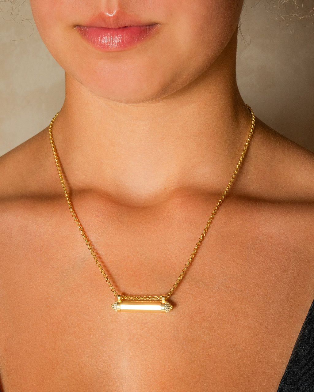 Kerala Pave openable amulet necklace in 14K or 18K yellow gold, worn by a model.