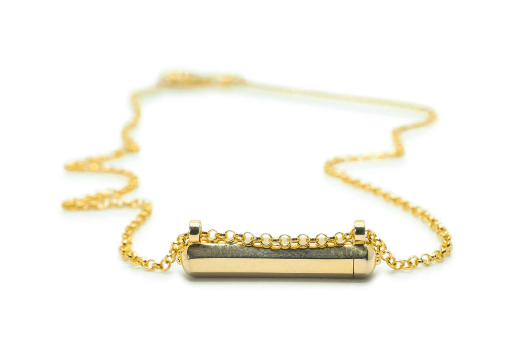 Kerala Small openable amulet necklace in solid gold, shown closed.