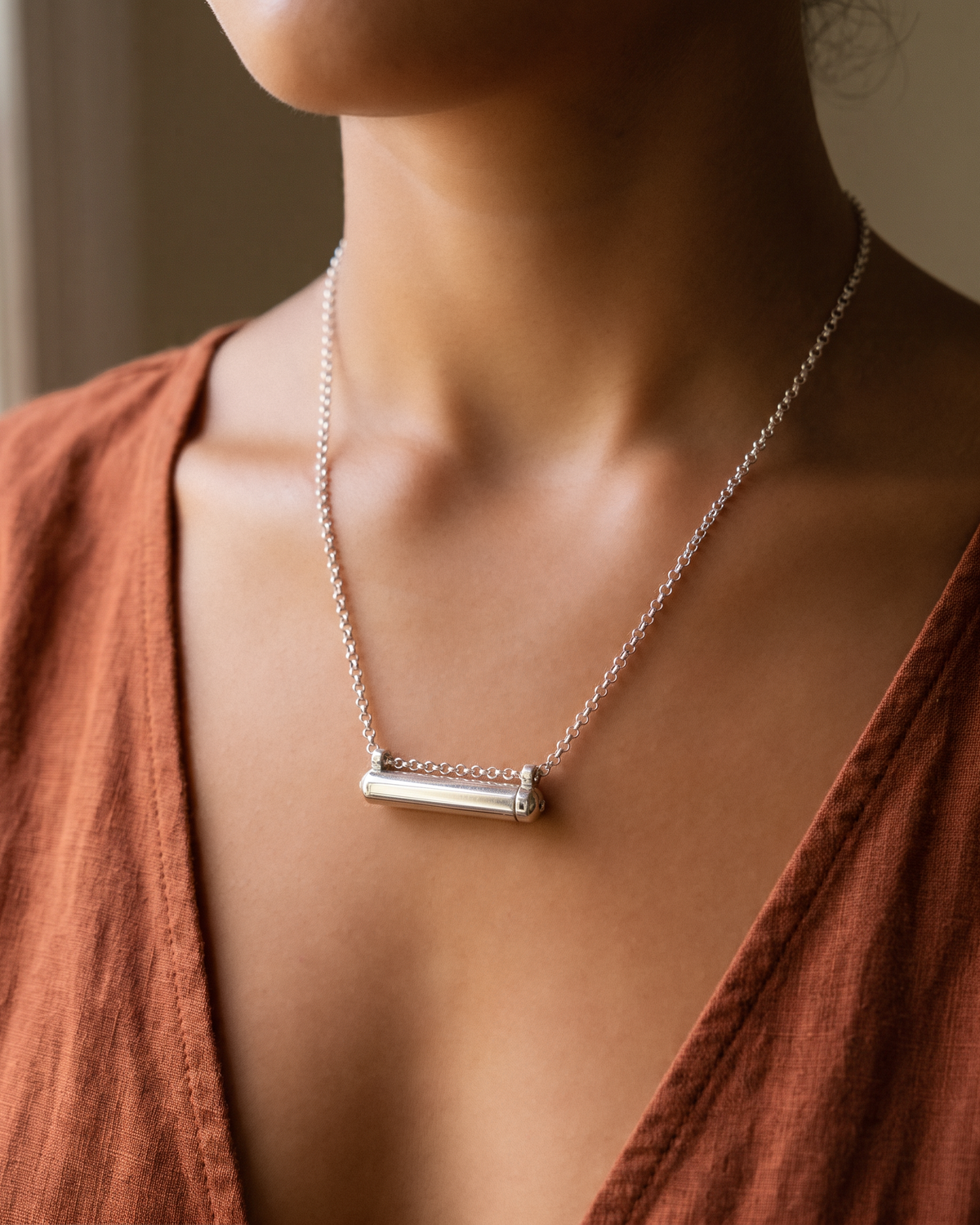 Sterling silver Kerala Small amulet necklace, worn.