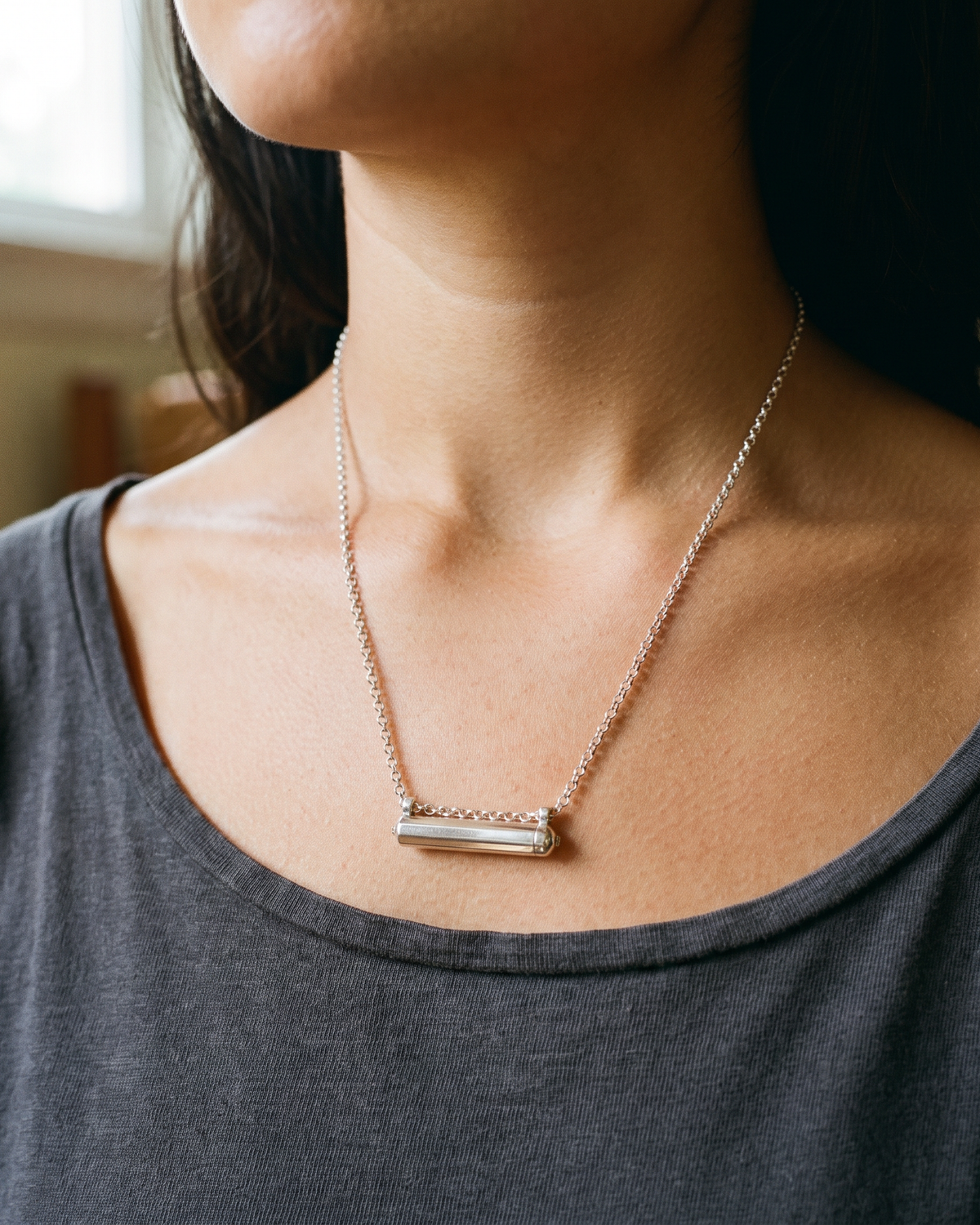 Sterling silver Kerala Small amulet necklace, worn, second view.