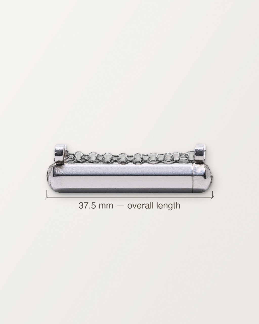 Sterling silver Kerala Small amulet with its length measured: 37.5 mm.