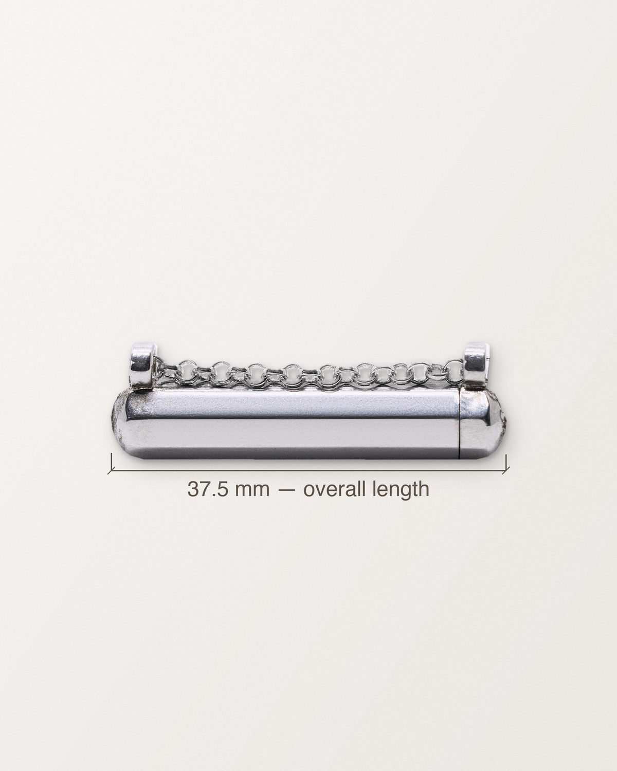 Sterling silver Kerala Small amulet with its length measured: 37.5 mm.