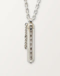 Kerala Vertical amulet necklace in sterling silver with white cubic zirconia baguettes, shown closed.