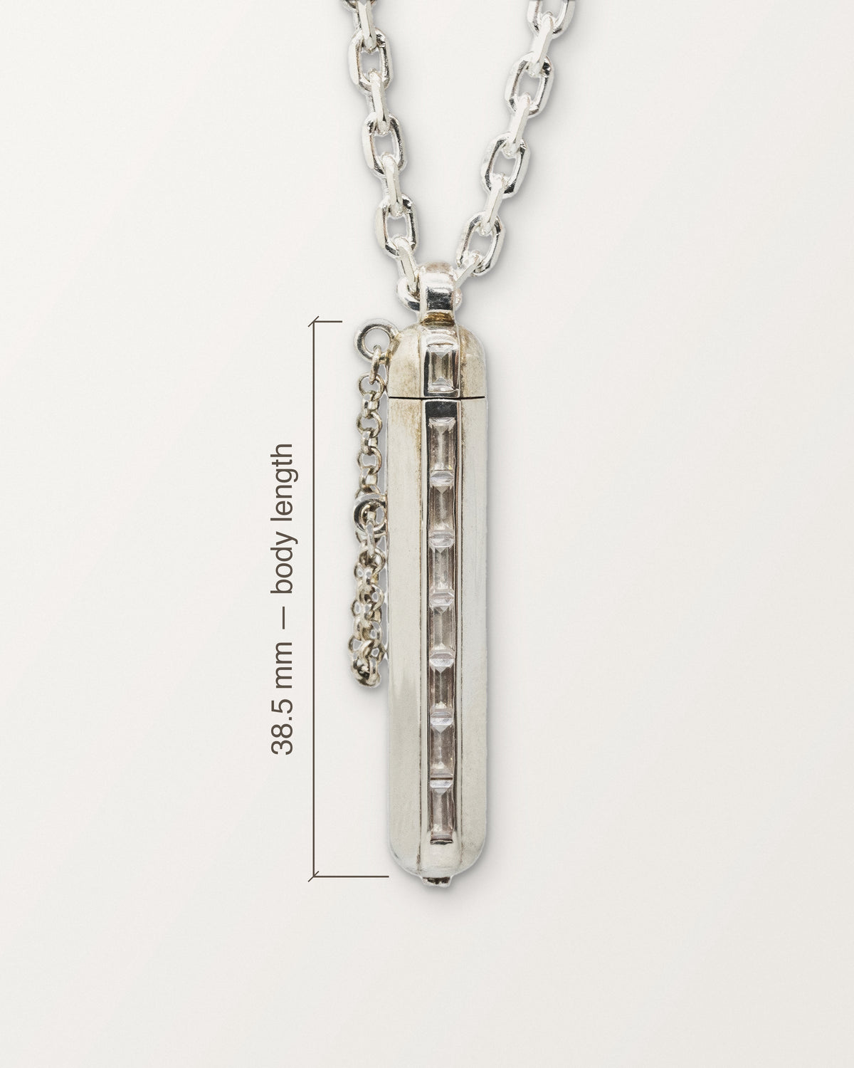 Kerala Vertical amulet in sterling silver with its body length marked: 38.5 mm.