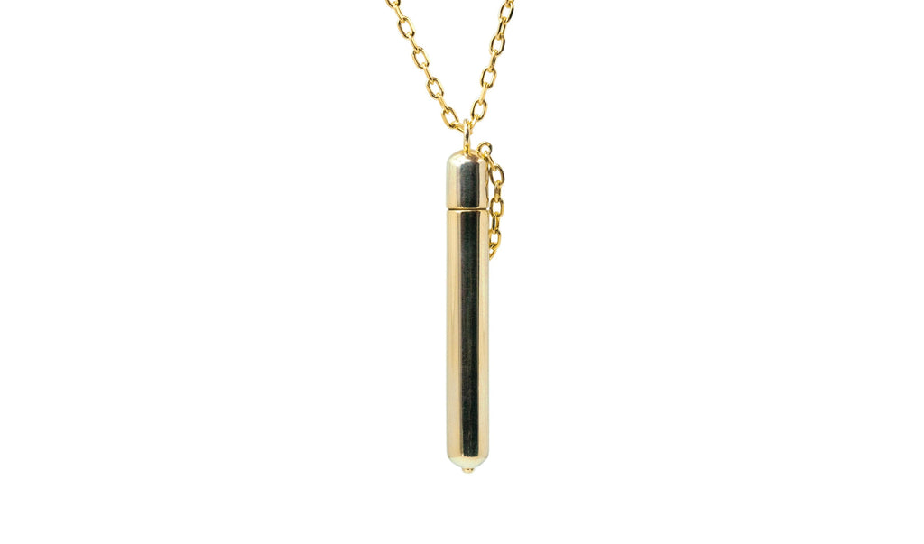 Moksha openable amulet necklace in solid gold, shown closed.