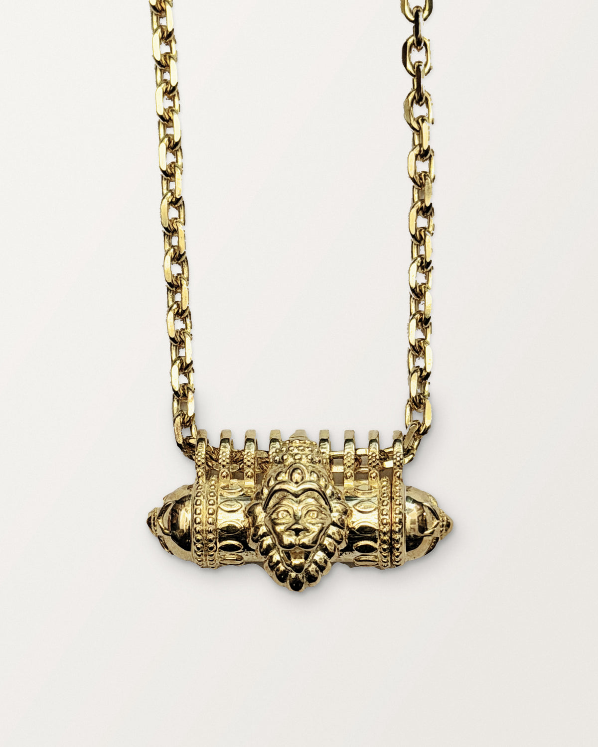 Narashimha openable amulet necklace in 14K or 18K yellow gold, shown closed on its chain.