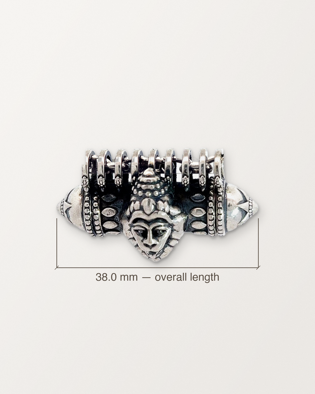 Sterling silver Narashimha amulet with its length measured: 38.0 mm.