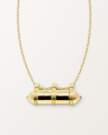 Pankaj openable amulet necklace in 14K or 18K yellow gold, shown closed with its photographed details and matched chain on a warm bone-white background.