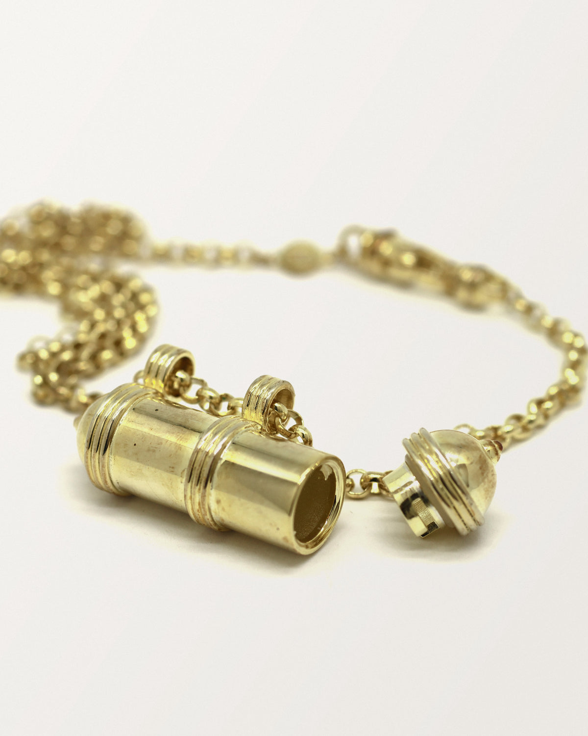 Pankaj openable amulet necklace in 14K or 18K yellow gold, shown open.