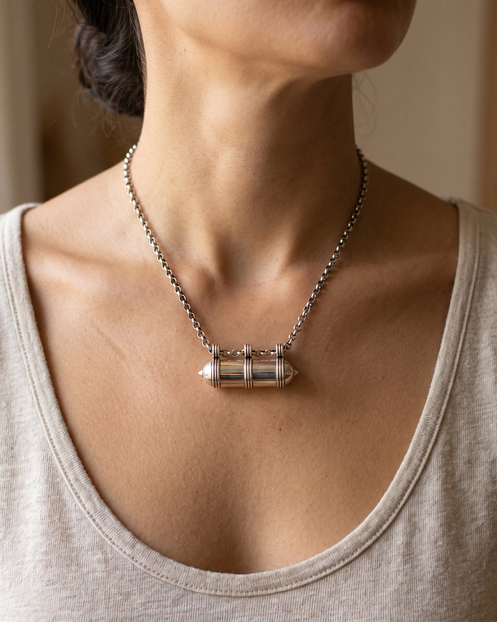 Pankaj openable heirloom amulet necklace in sterling silver, worn.