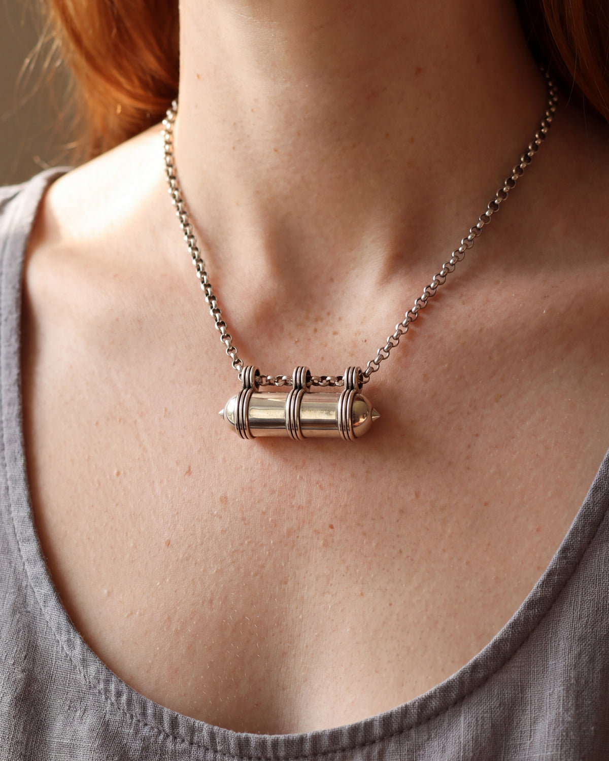 Pankaj openable heirloom amulet necklace in sterling silver, worn, closer view.