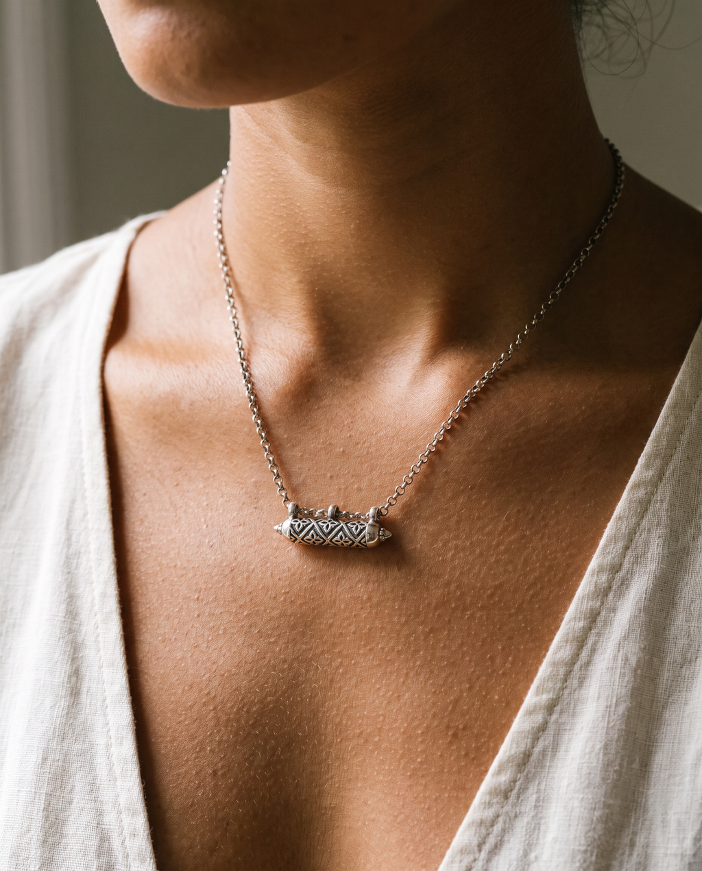 Shakti openable heirloom amulet necklace in sterling silver, worn.