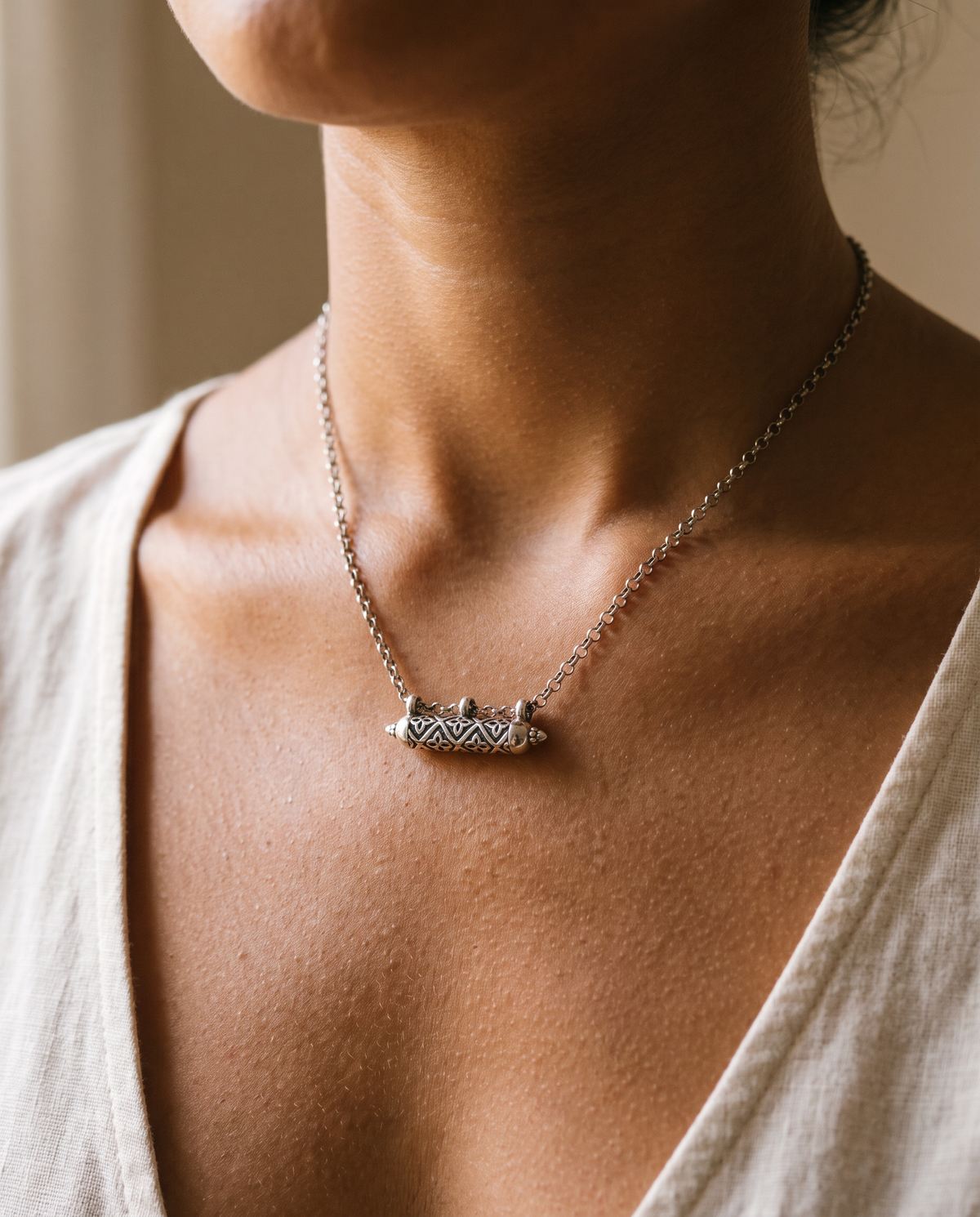 Shakti openable heirloom amulet necklace in sterling silver, worn, second view.