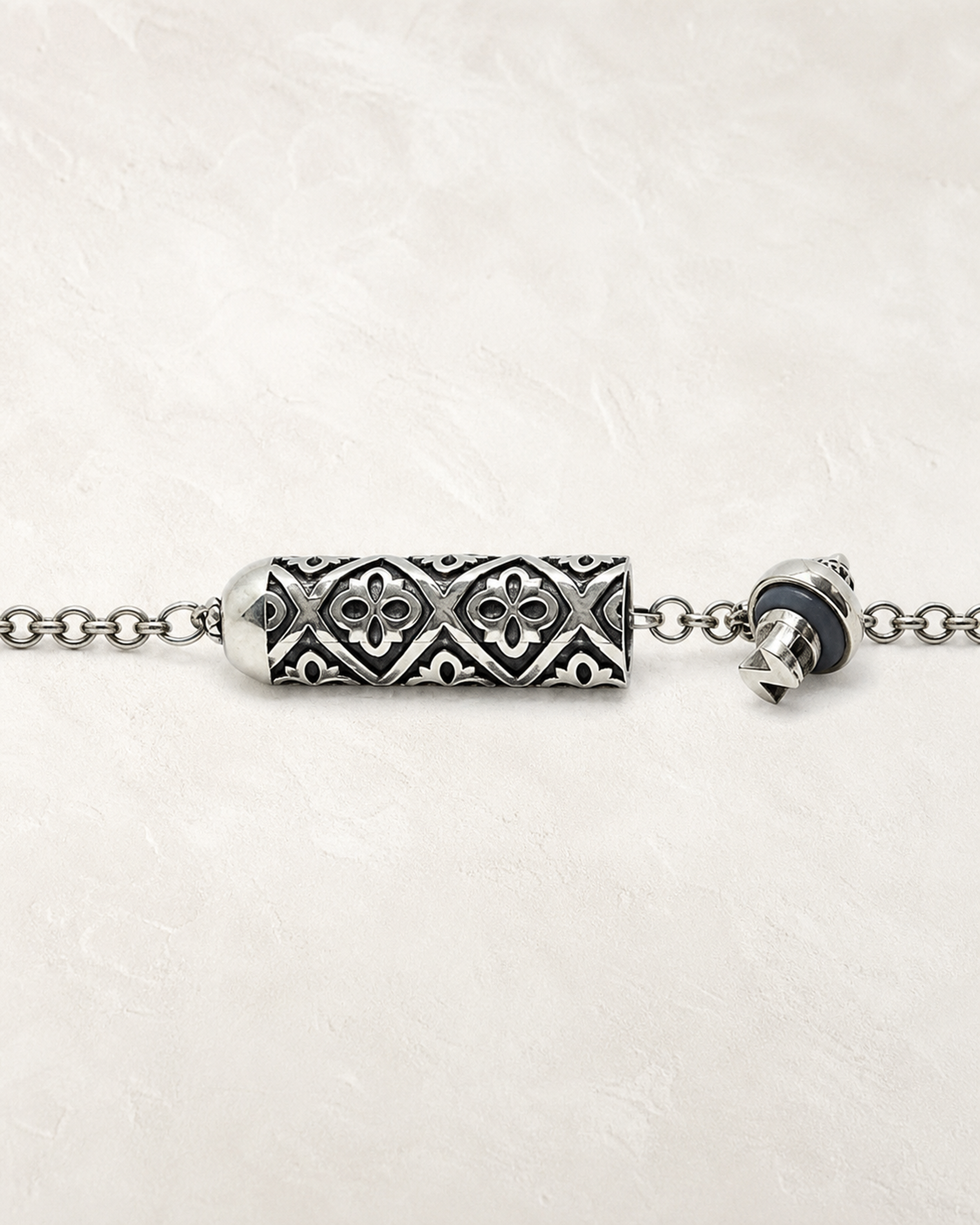 Shakti openable amulet necklace in sterling silver, shown open with the cap, gasket, chamber, and chain visible.