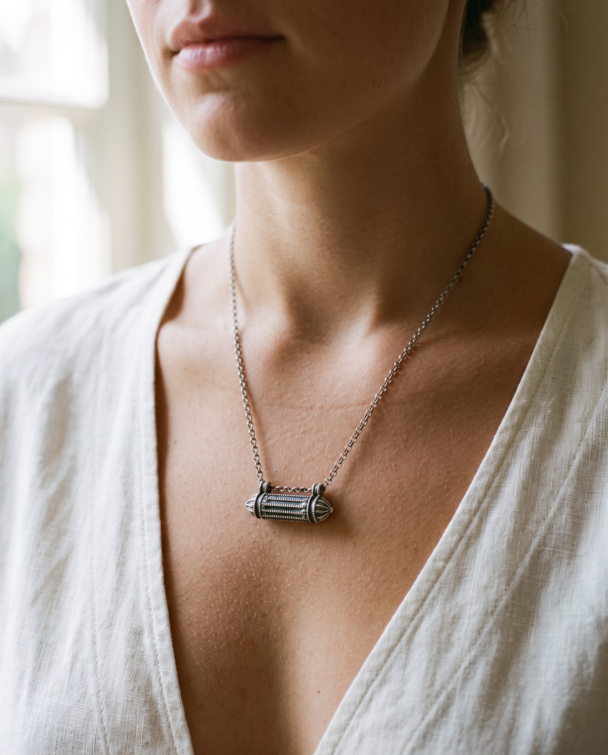 Sterling silver Taweez amulet necklace, worn.