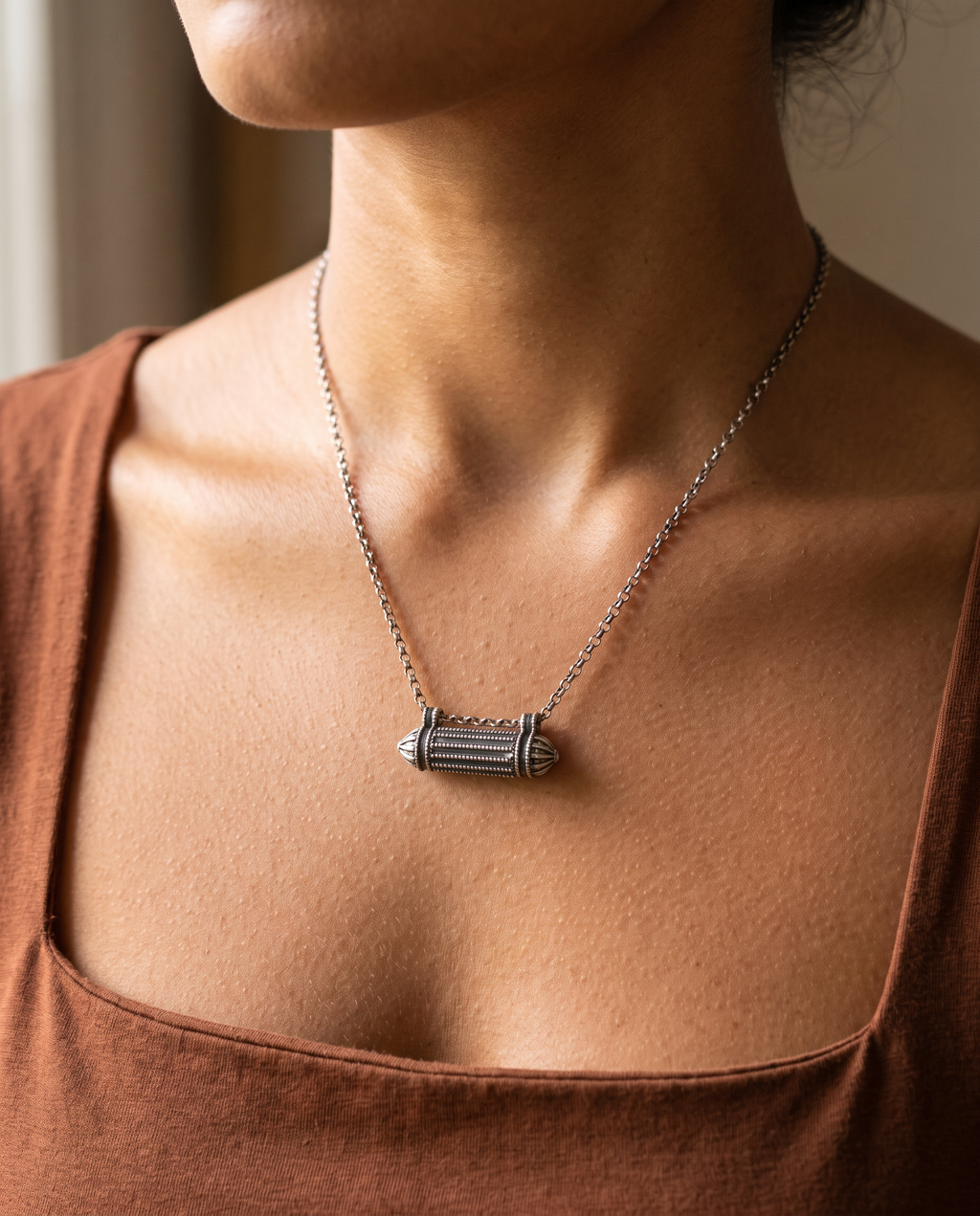 Sterling silver Taweez amulet necklace, worn, second view.