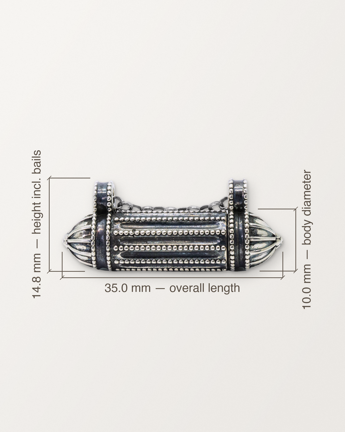 Sterling silver Taweez amulet with its measurements: 35.0 mm long, 14.8 mm tall including the bails, 10.0 mm across.