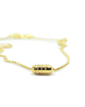 Vámana openable amulet necklace in 14K or 18K yellow gold, shown closed.