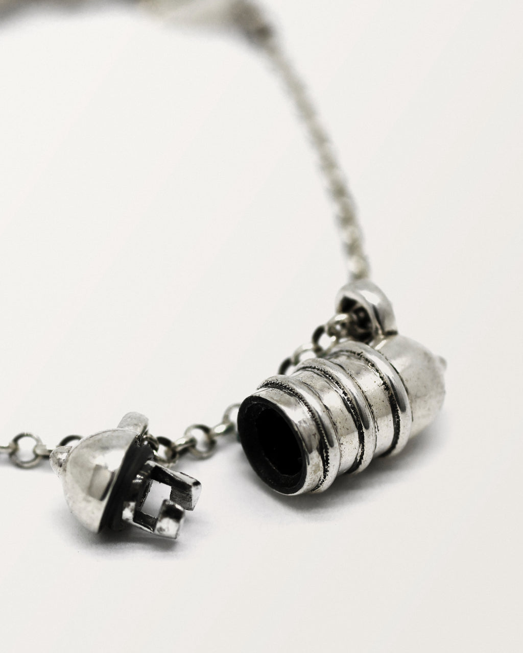 Vámana amulet necklace in sterling silver, shown open with the chamber visible.