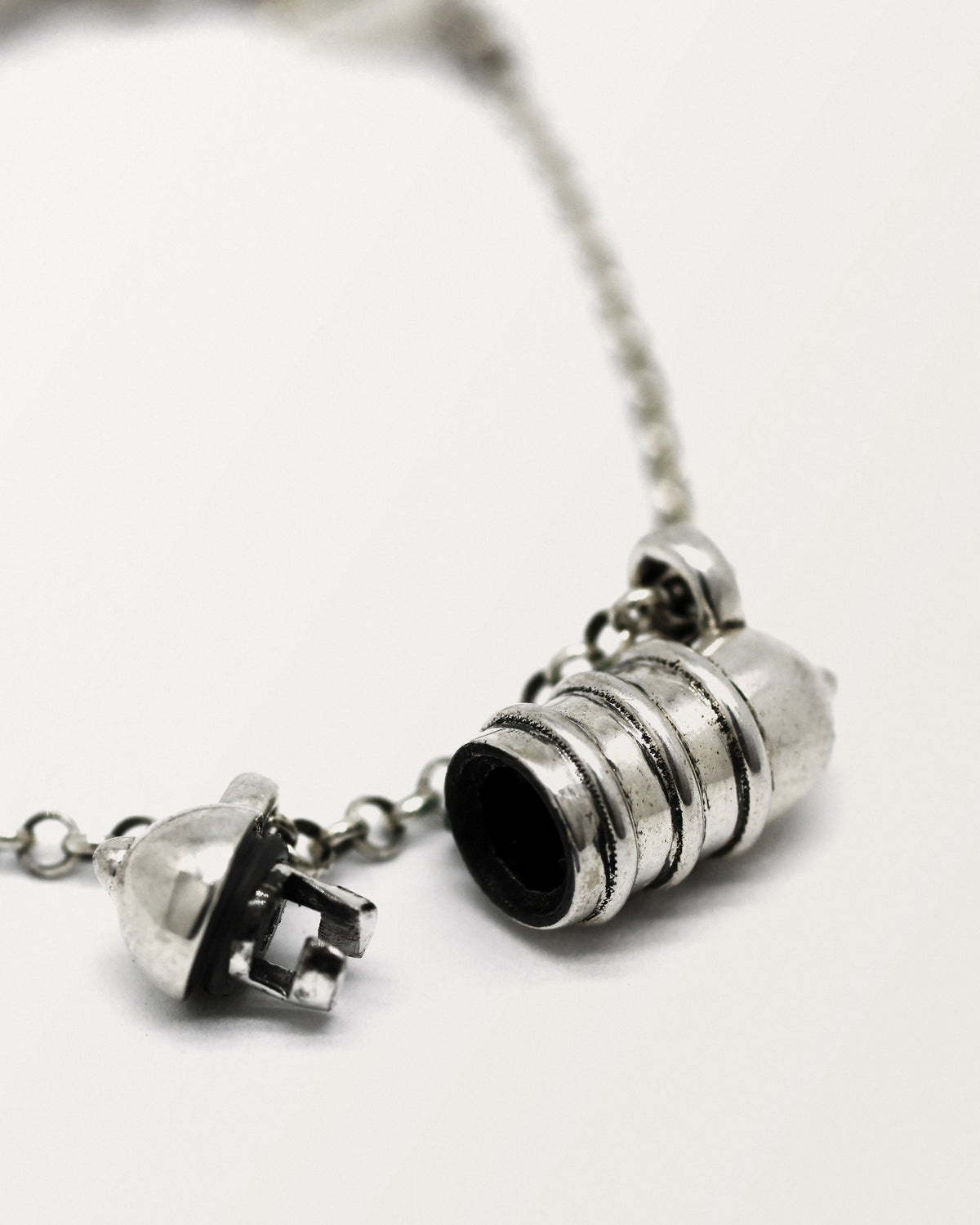 Vámana amulet necklace in sterling silver, shown open with the chamber visible.