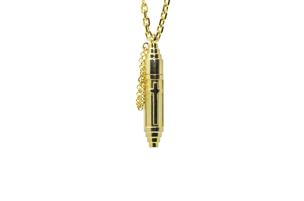 Vertical Cross openable amulet necklace in solid gold, shown closed.