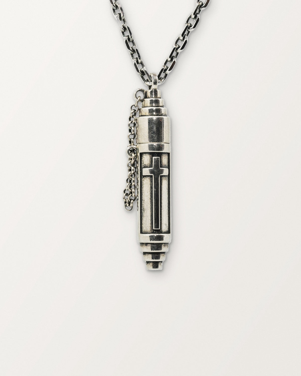 Vertical Cross amulet necklace in sterling silver, shown closed.