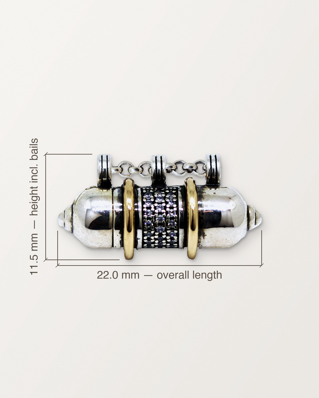 Sterling silver Vidya amulet with its measurements: 22.0 mm long and 11.5 mm high.