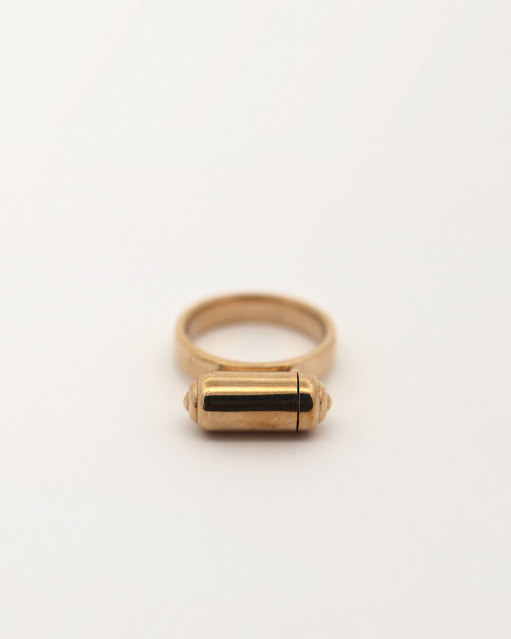 VRAT openable ring amulet in 14K yellow gold, shown closed.