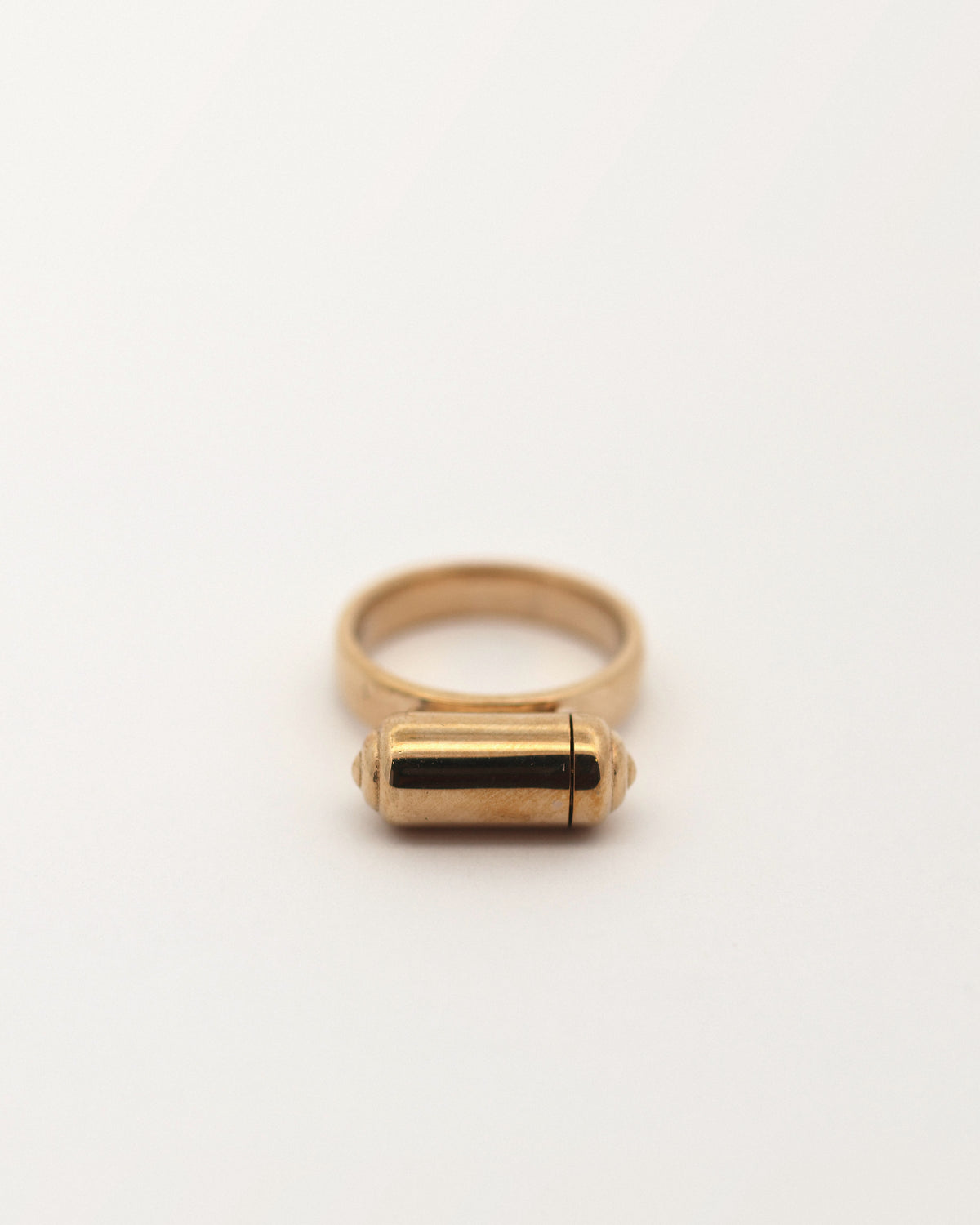 VRAT openable ring amulet in 14K yellow gold, shown closed.