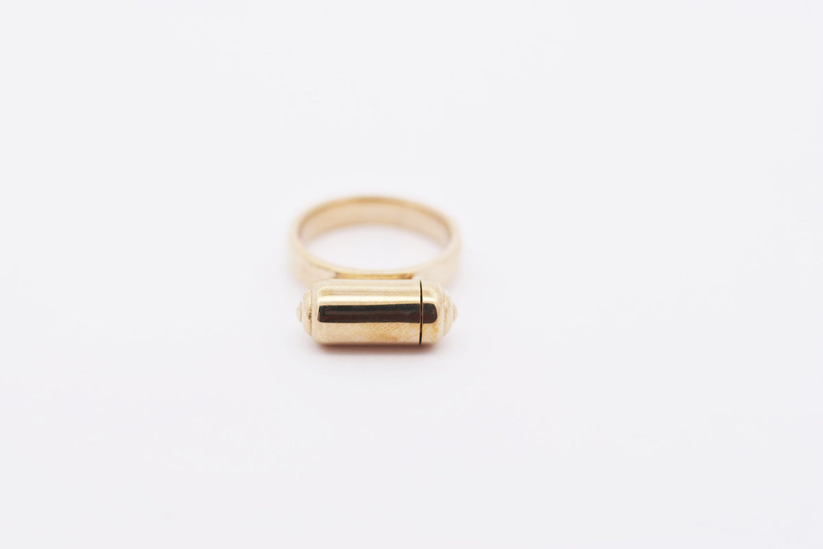 VRAT openable ring amulet in solid gold, shown closed.