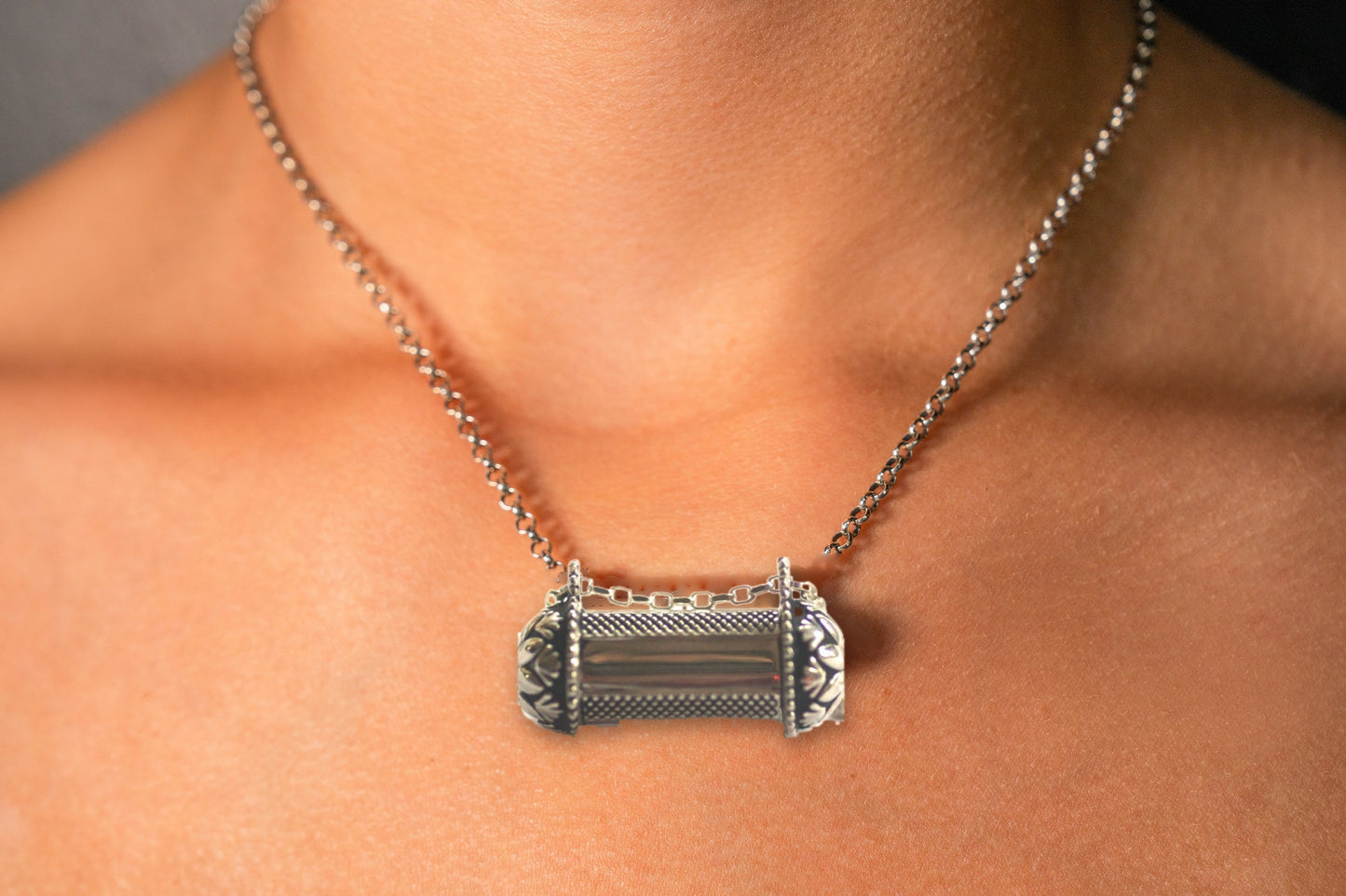 Pushpa Kavacha sterling silver amulet necklace worn on model