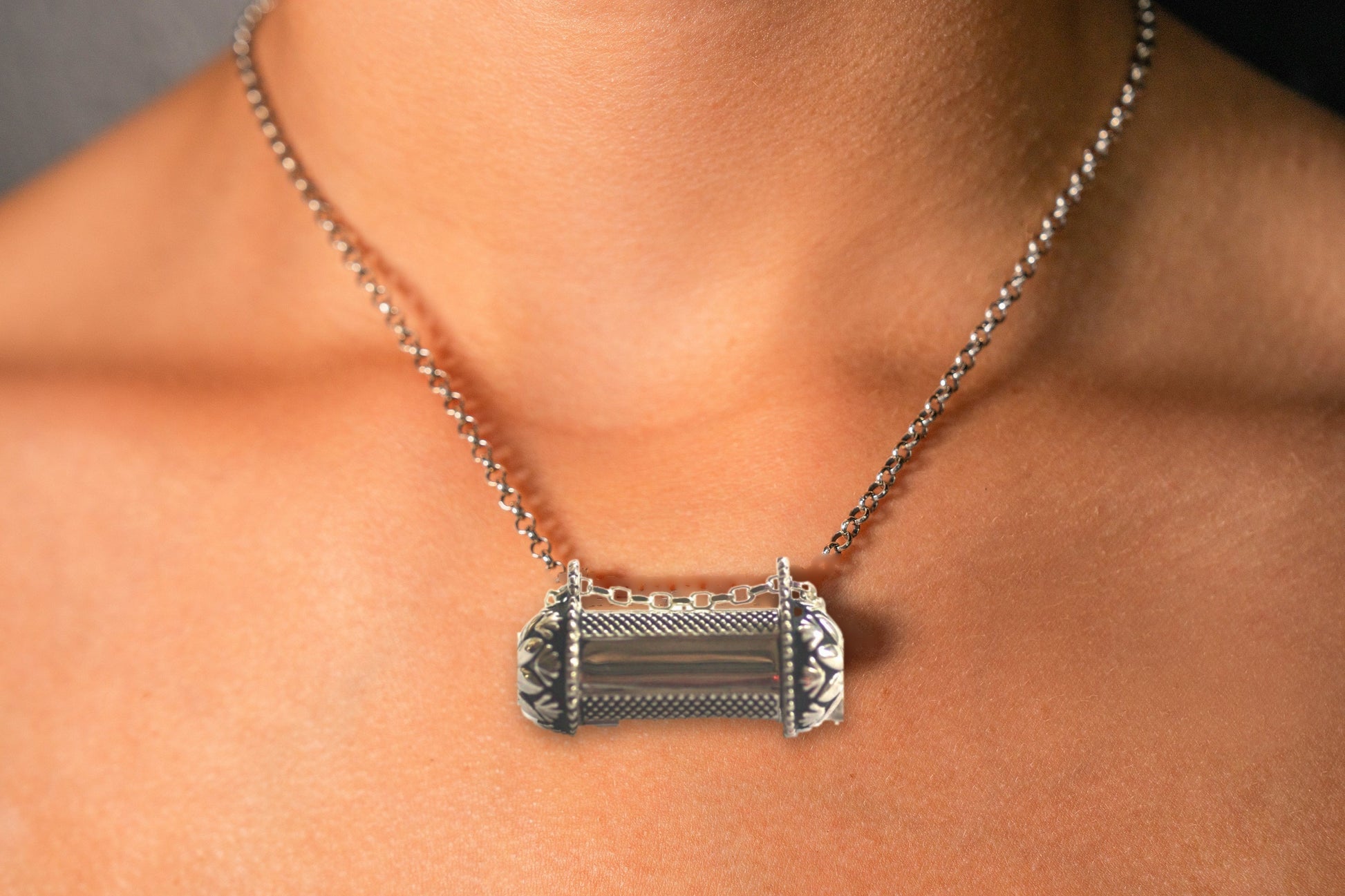 Pushpa Kavacha sterling silver amulet necklace worn on model