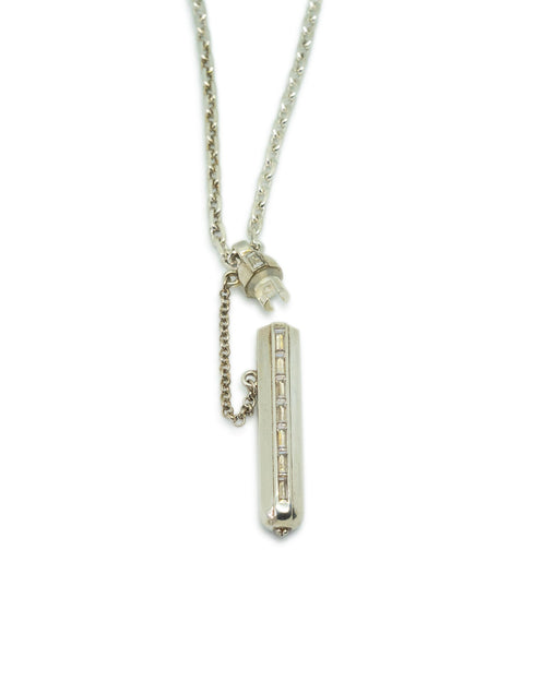 Kerala Vertical amulet necklace in sterling silver, shown open with the chamber visible.