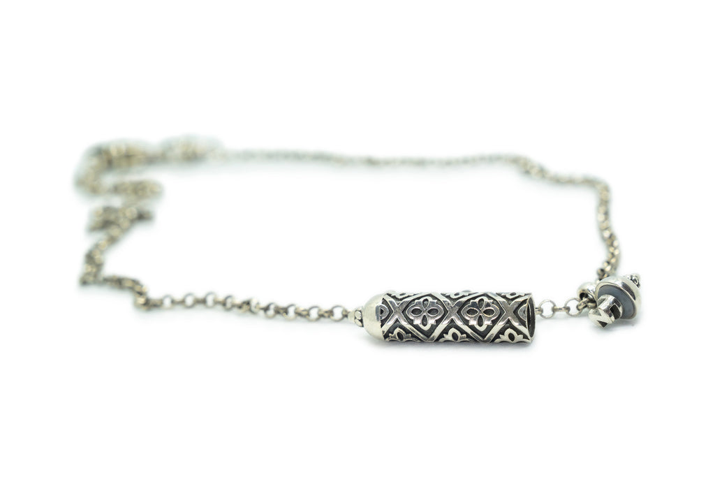 Shakti sterling silver amulet necklace shown open.