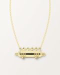Yemen Wedding openable amulet necklace in 14K or 18K yellow gold, shown closed on a warm bone-white background.